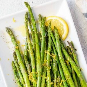 sous vide asparagus on white plate