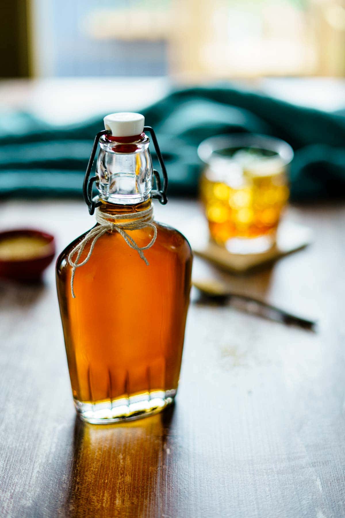 demerara syrup with whiskey cocktail in background