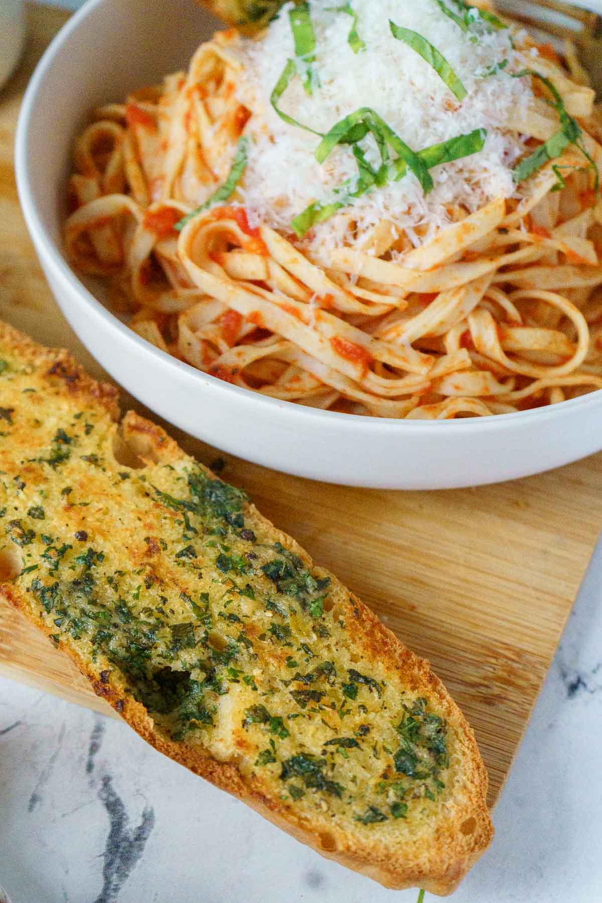 serving garlic bread with pasta