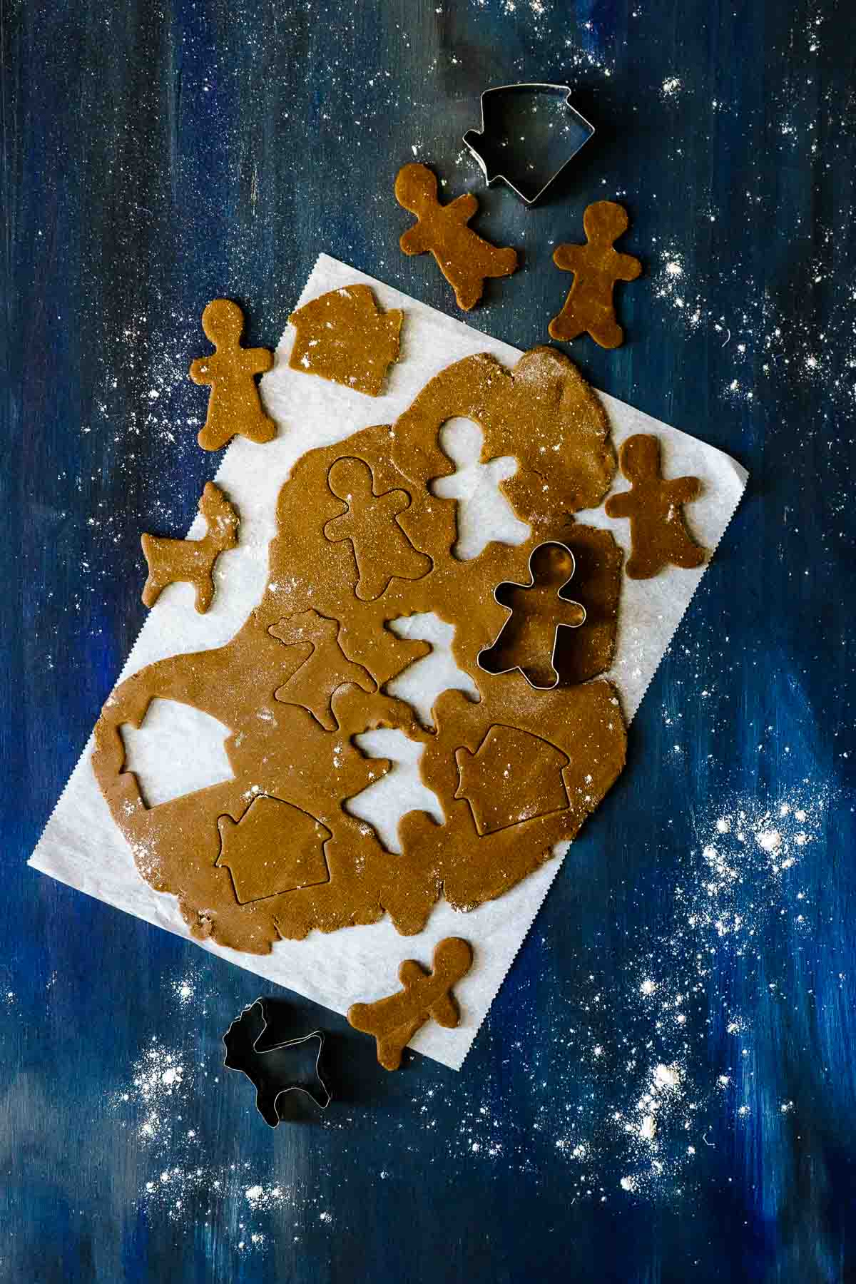 rolling out gingerbread dough and cutting shapes