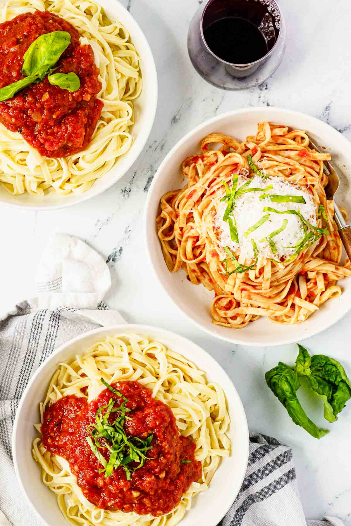 bowls of pasta with marinara sauce