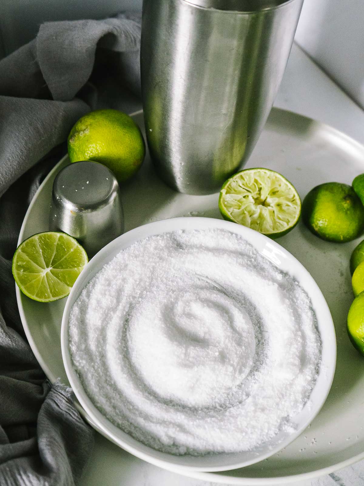 plate of kosher salt with cocktail shaker