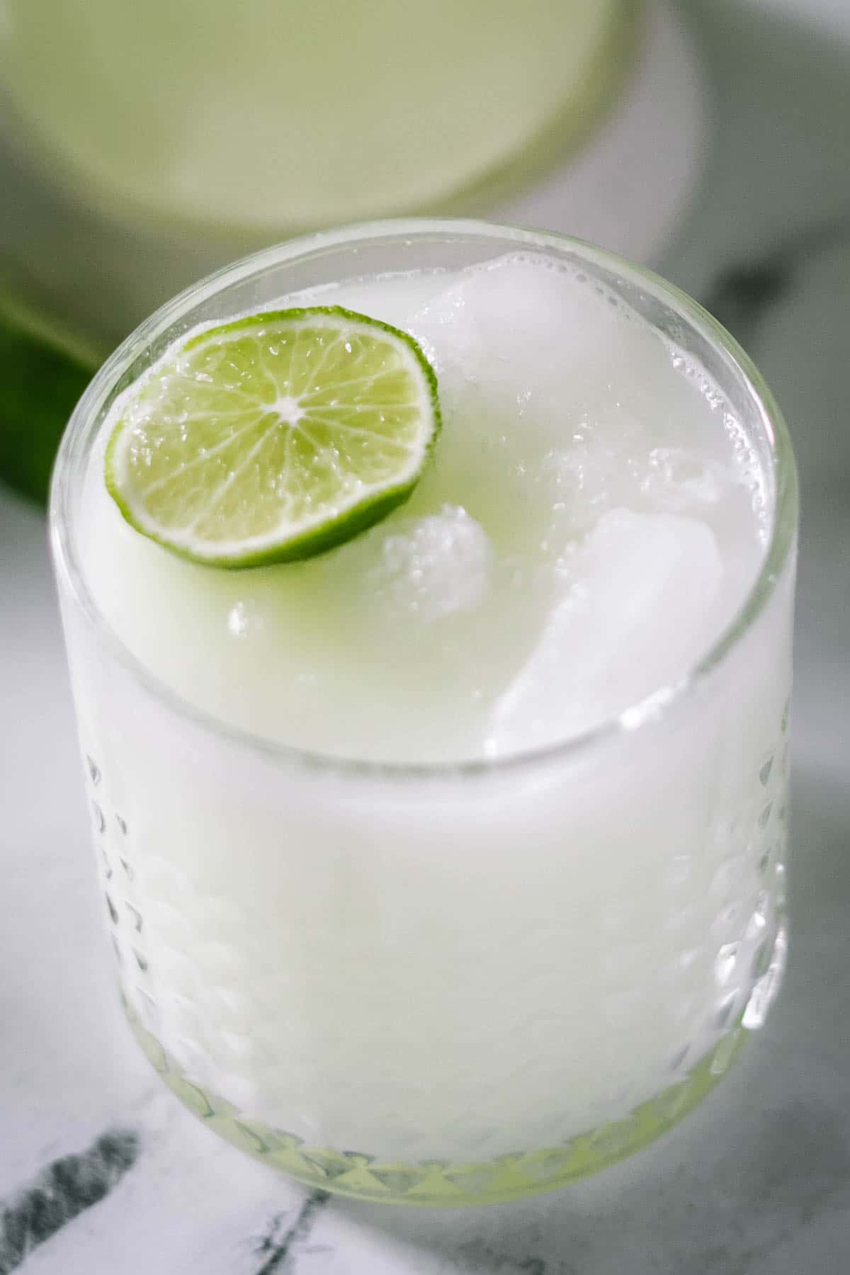 vodka margarita in a glass with a lime wedge
