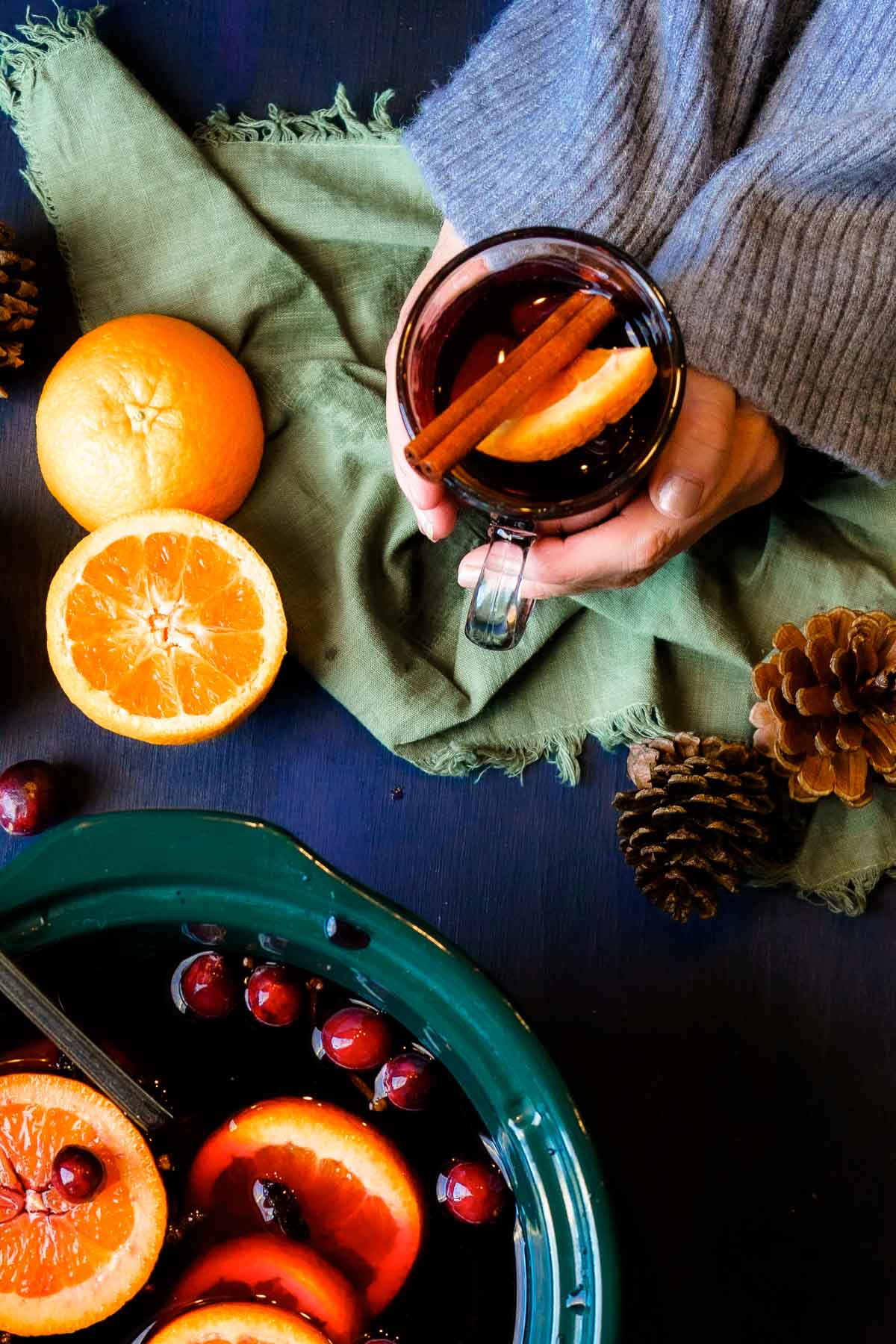 person holding a mug of mulled wine