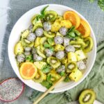 serving bowl with dragon fruit, kiwi, and pinapple