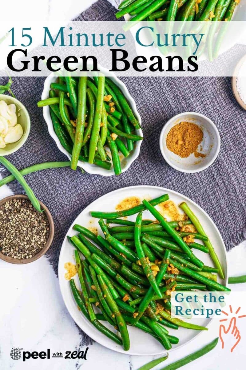 Plate of curried green beans with spices and garlic on a gray cloth. Text overlay says "15 Minute Curried Green Beans" and "Get the Recipe.