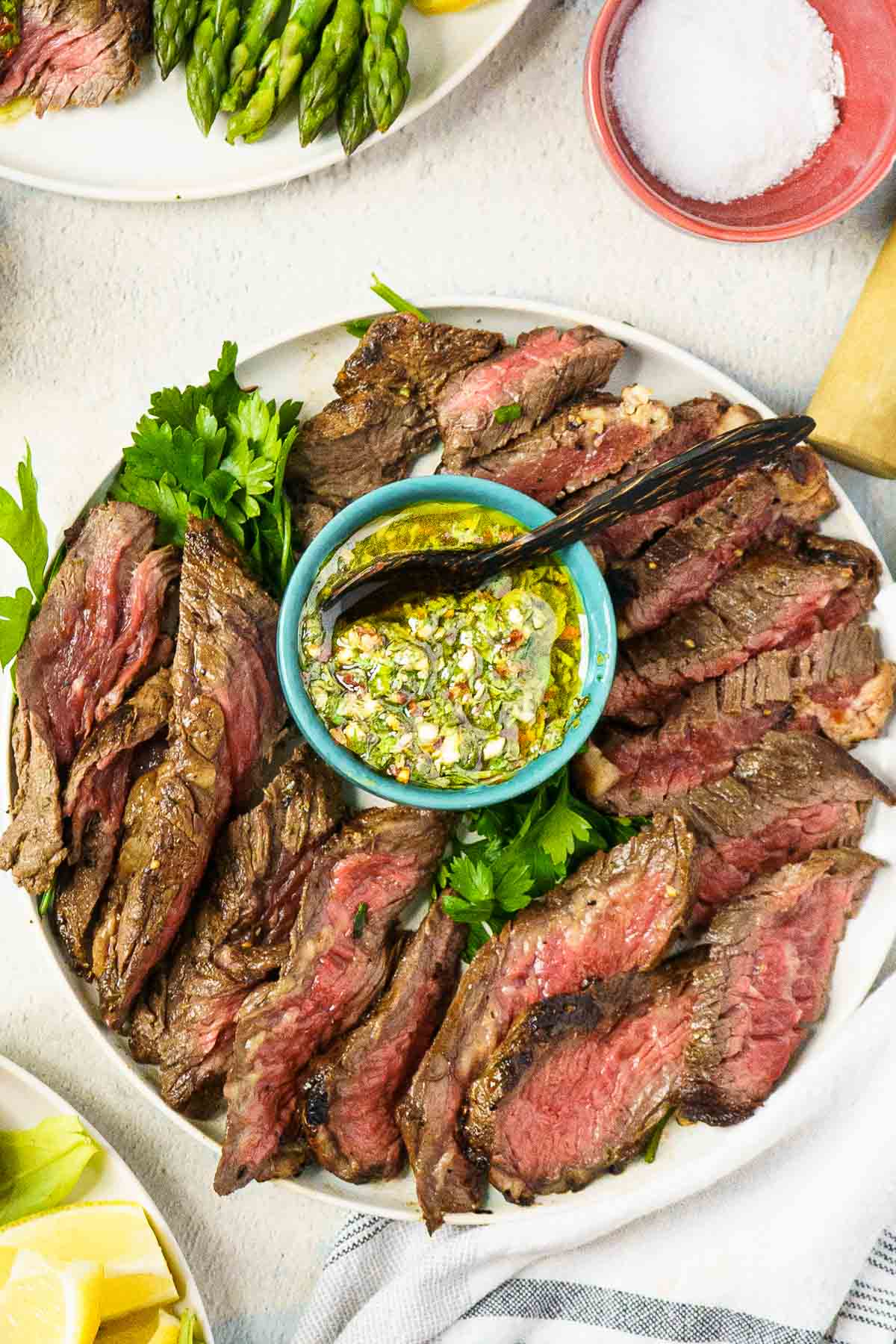 steak being served with chimichurri