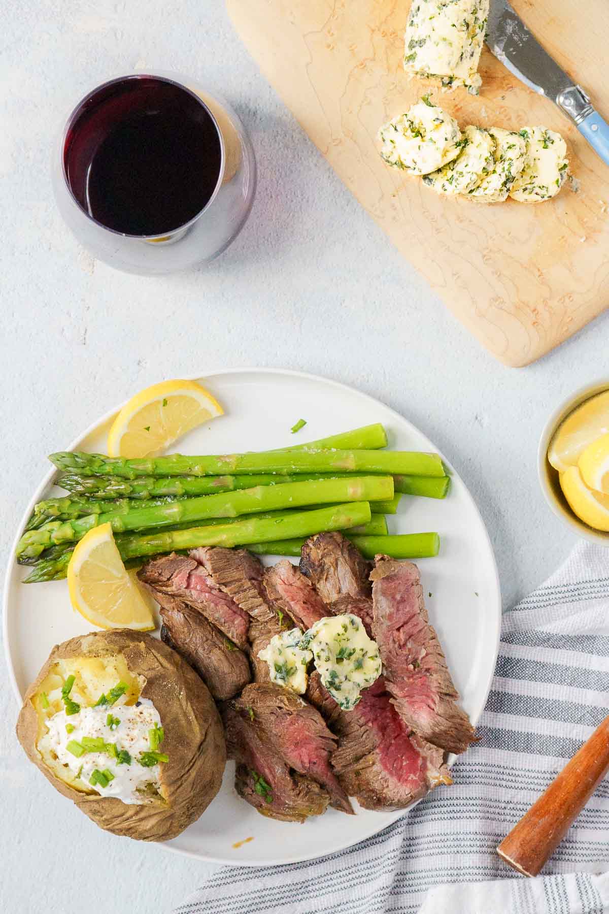 steak dinner topped with herb compound butter 