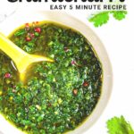 chimichurri sauce in a white bowl with a yellow spoon