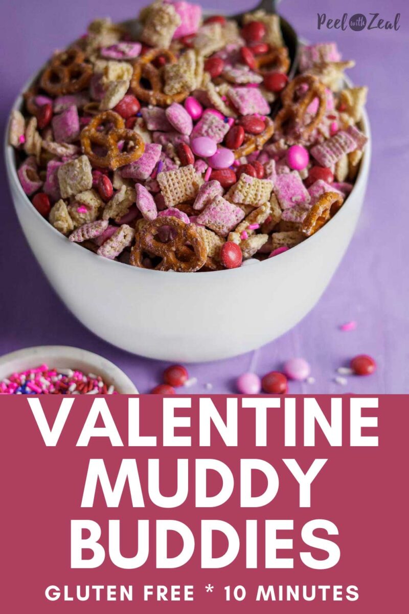 bowl of pink muddy buddy chex mix in a white bowl