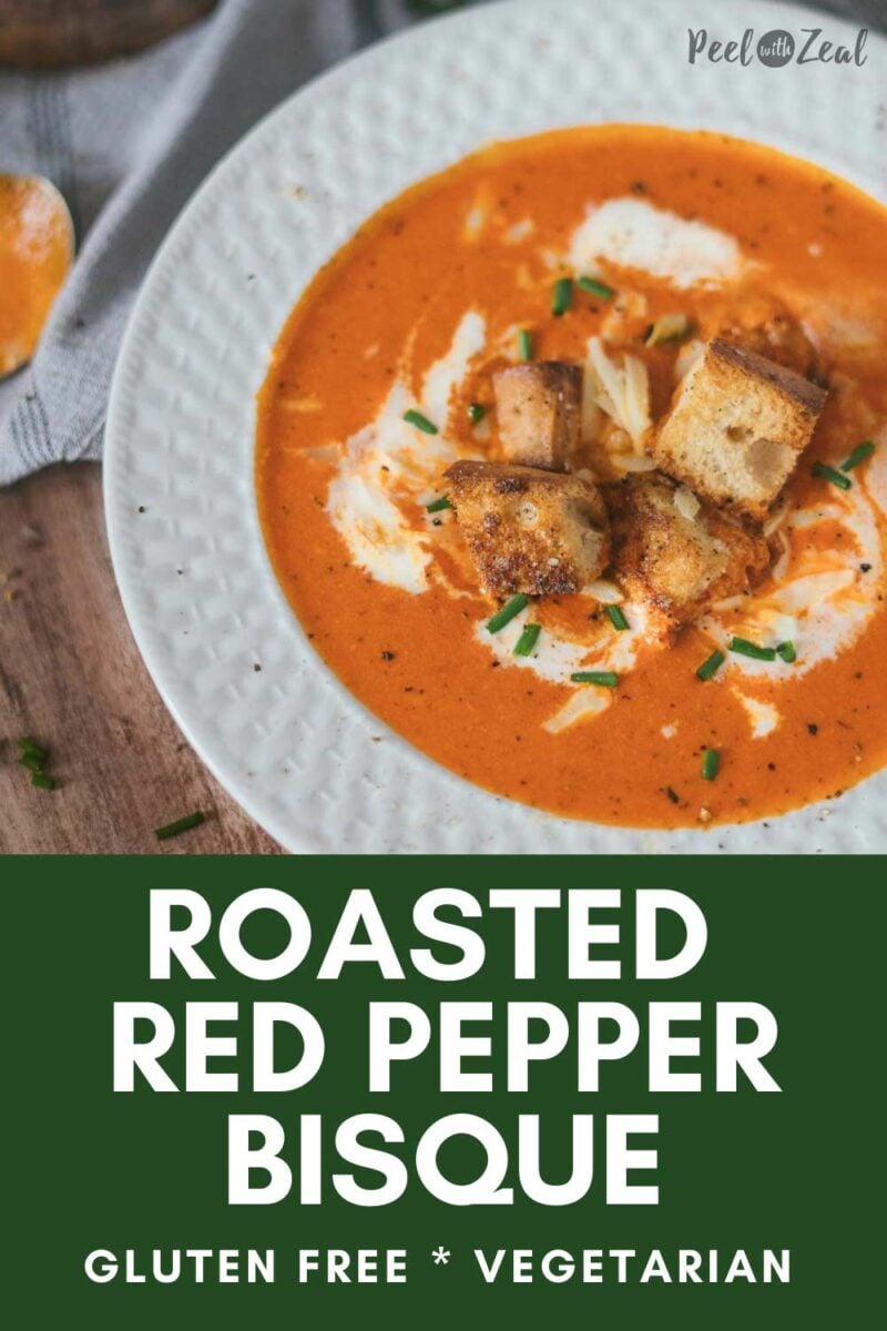 Roasted red pepper soup on a white bowl.