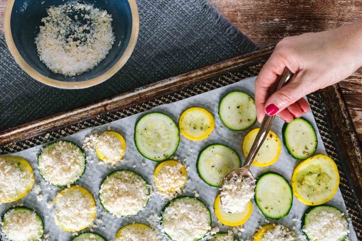 spooning on the parmesan mixture onto the individual slices.