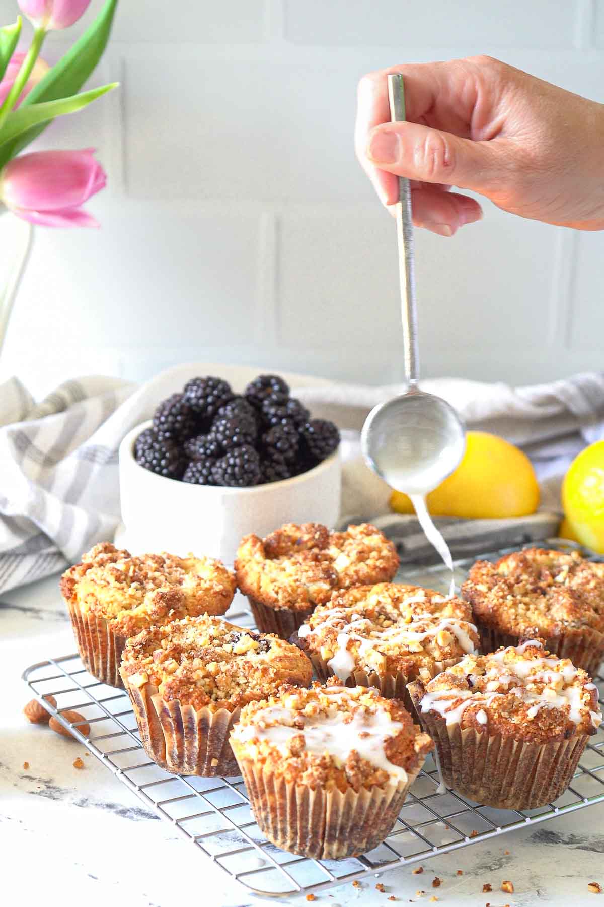 drizzle lemon glaze onto blackberry muffins.