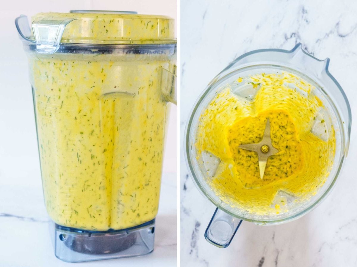 A blender filled with a yellow, herb-speckled mixture for a delicious white asparagus recipe is shown from the side and from above on a white surface.
