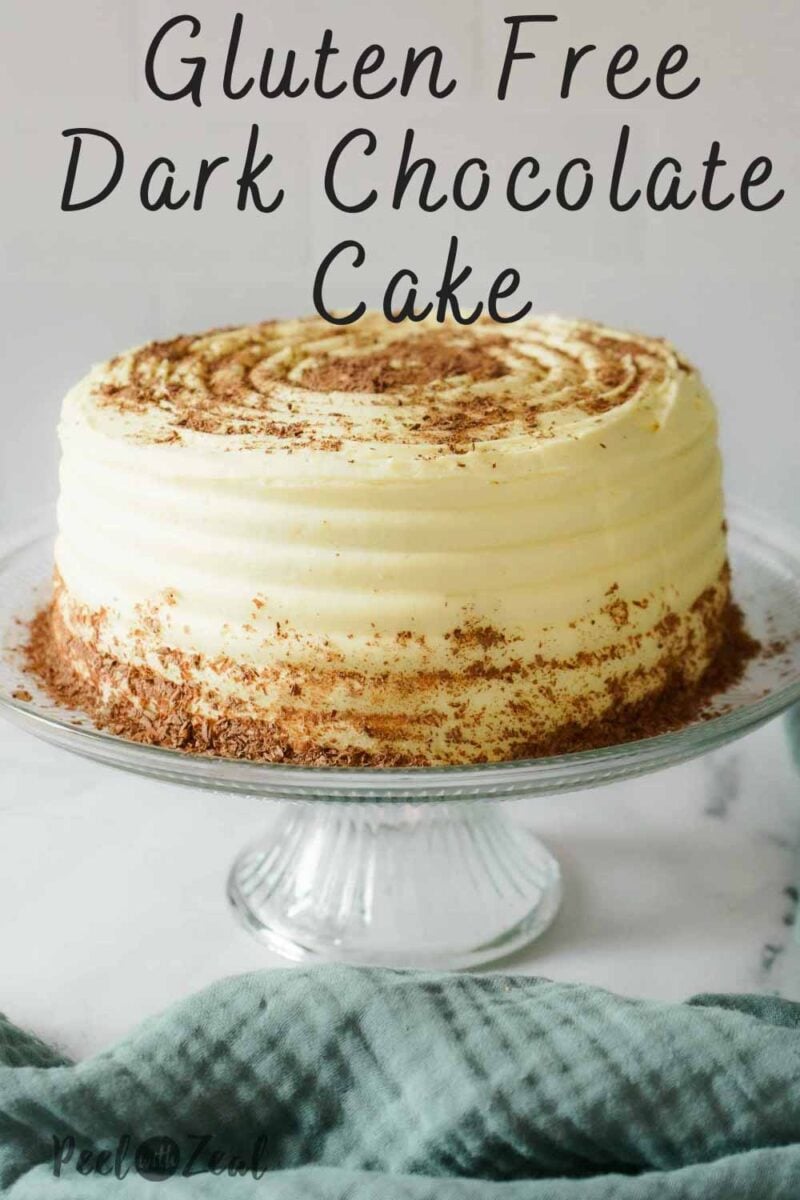 chocolate cake with white buttercream on cake plate.