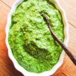 ramp pesto in bowl on wooden table.
