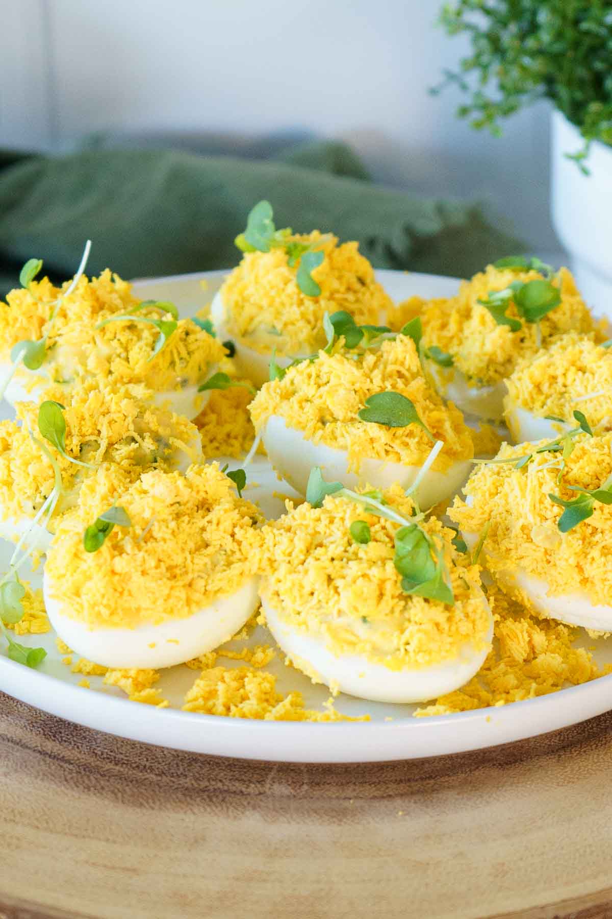 french deviled eggs on a serving platter. 