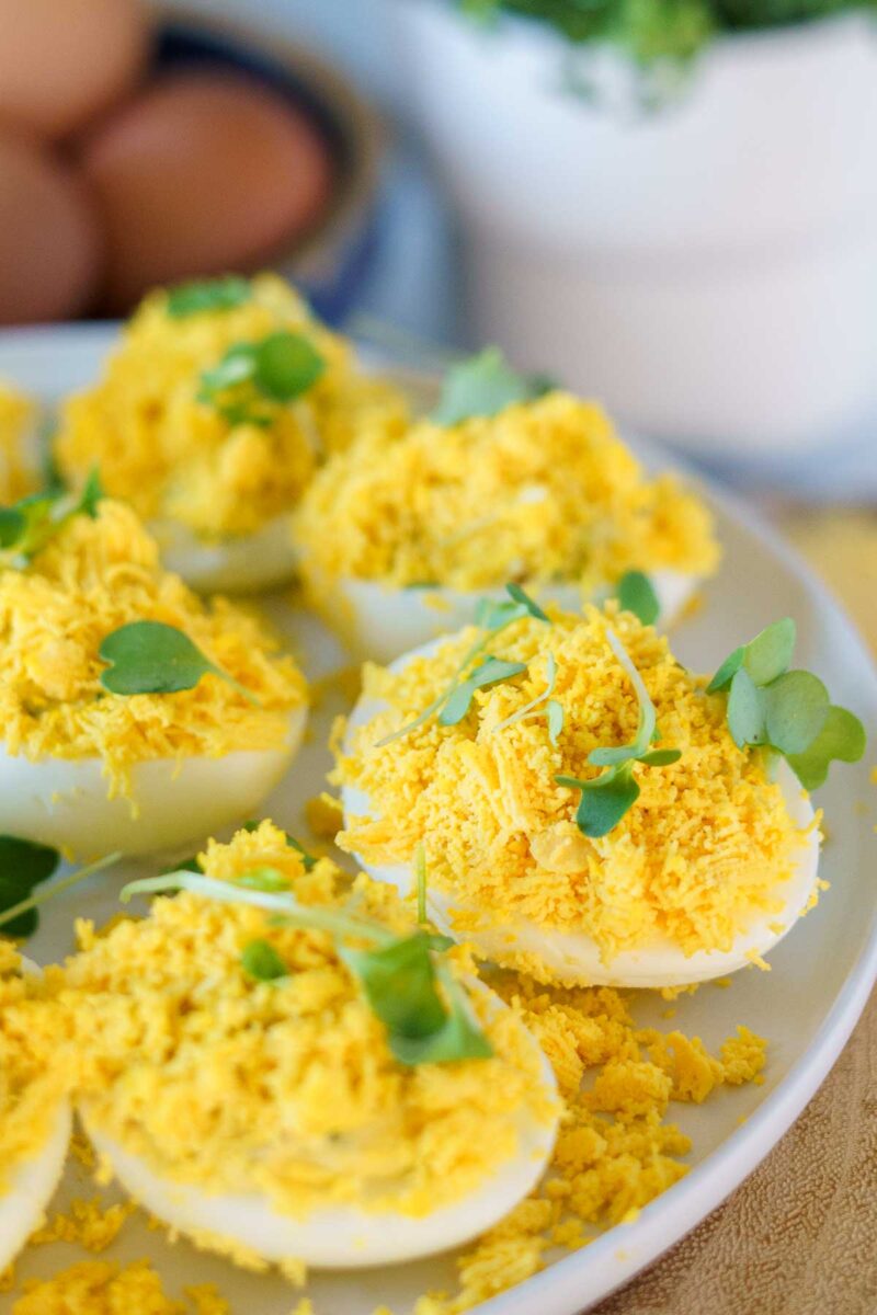eggs mimosa on a plate with microgreens.