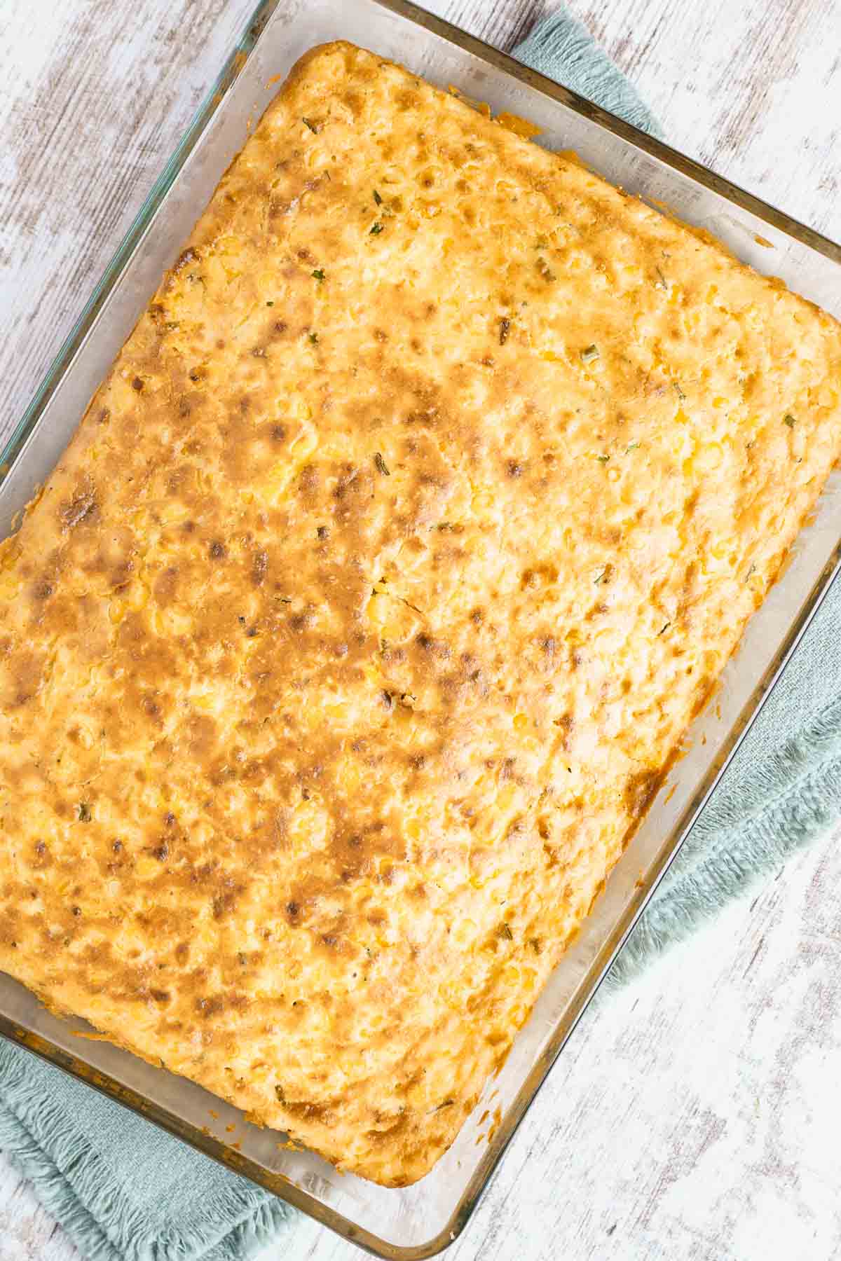 baked corn pudding cooling on counter. 