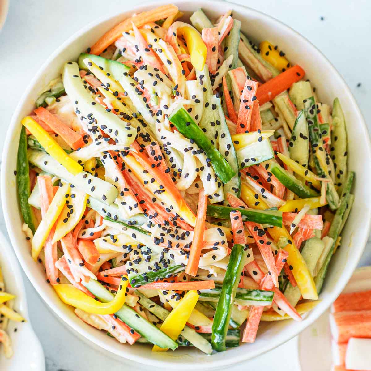 https://www.peelwithzeal.com/wp-content/uploads/2022/03/spicy-kani-salad-with-mango.jpg
