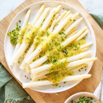 white asparagus with hollandaise and spring herbs.