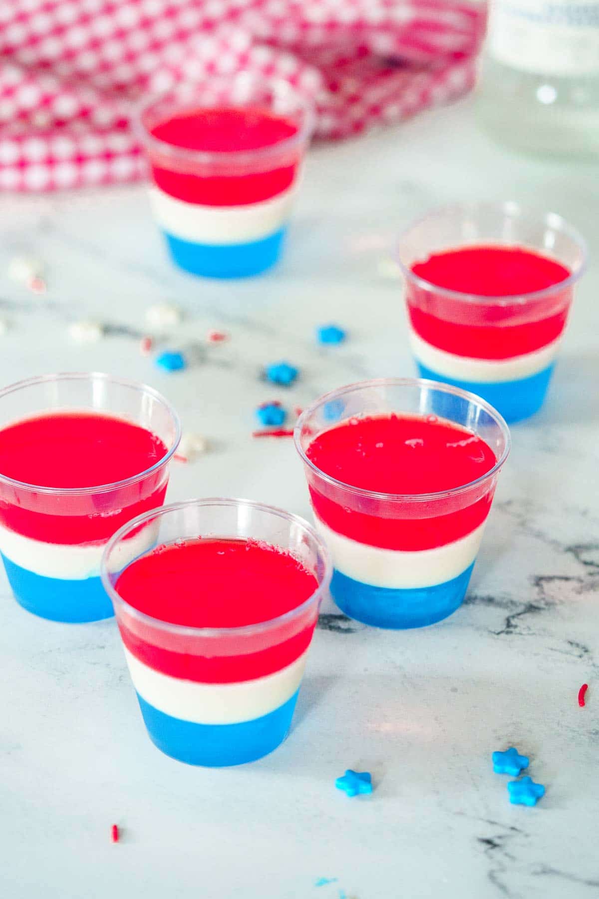 5 jello shots on a marble counter