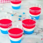 red white and blue layered jello shots on counter