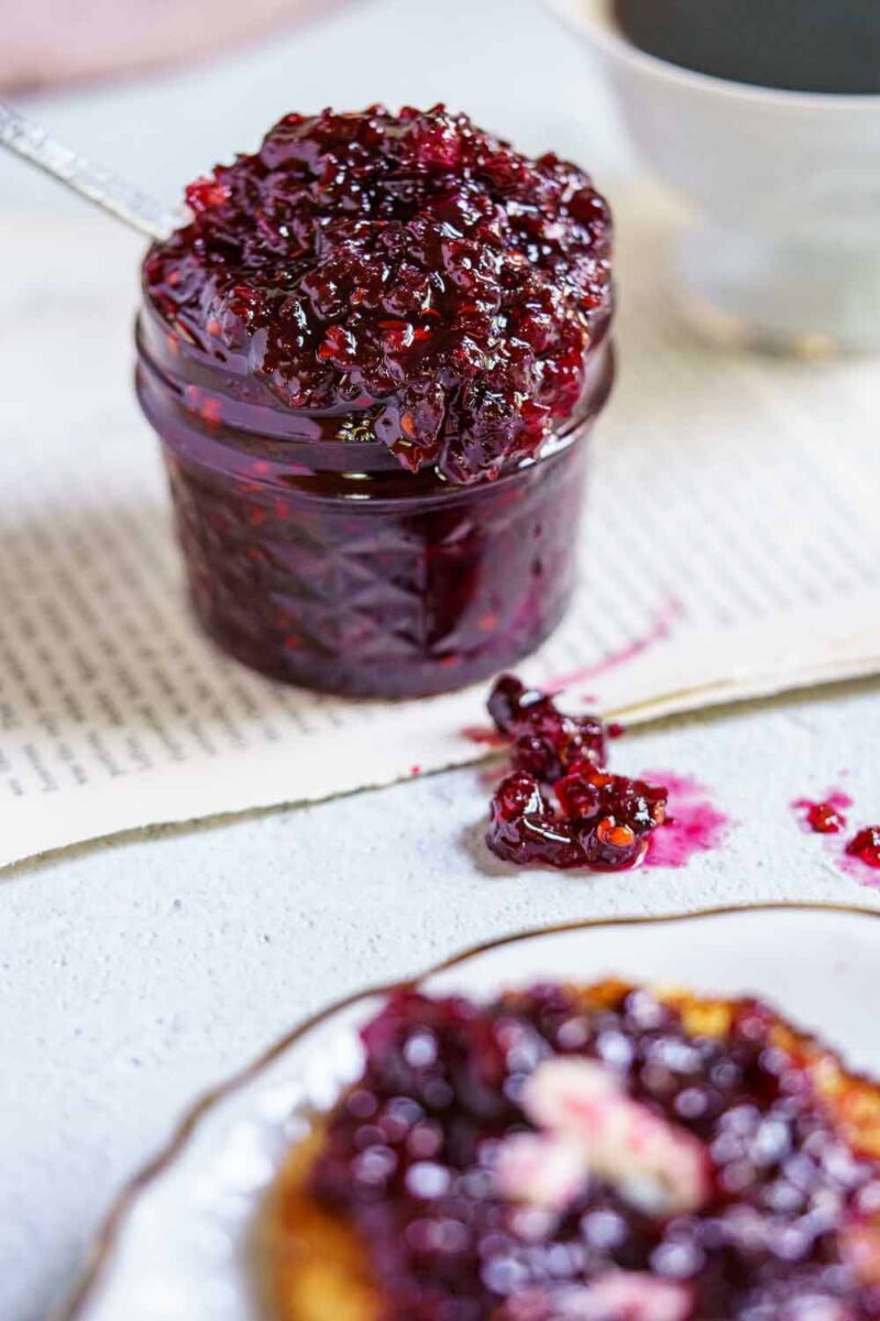 serviceberry jam in a jar and a slice of toast