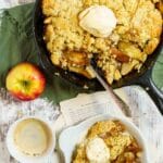 a serving gluten free apple cobbler with vanilla ice cream and a cup of copy