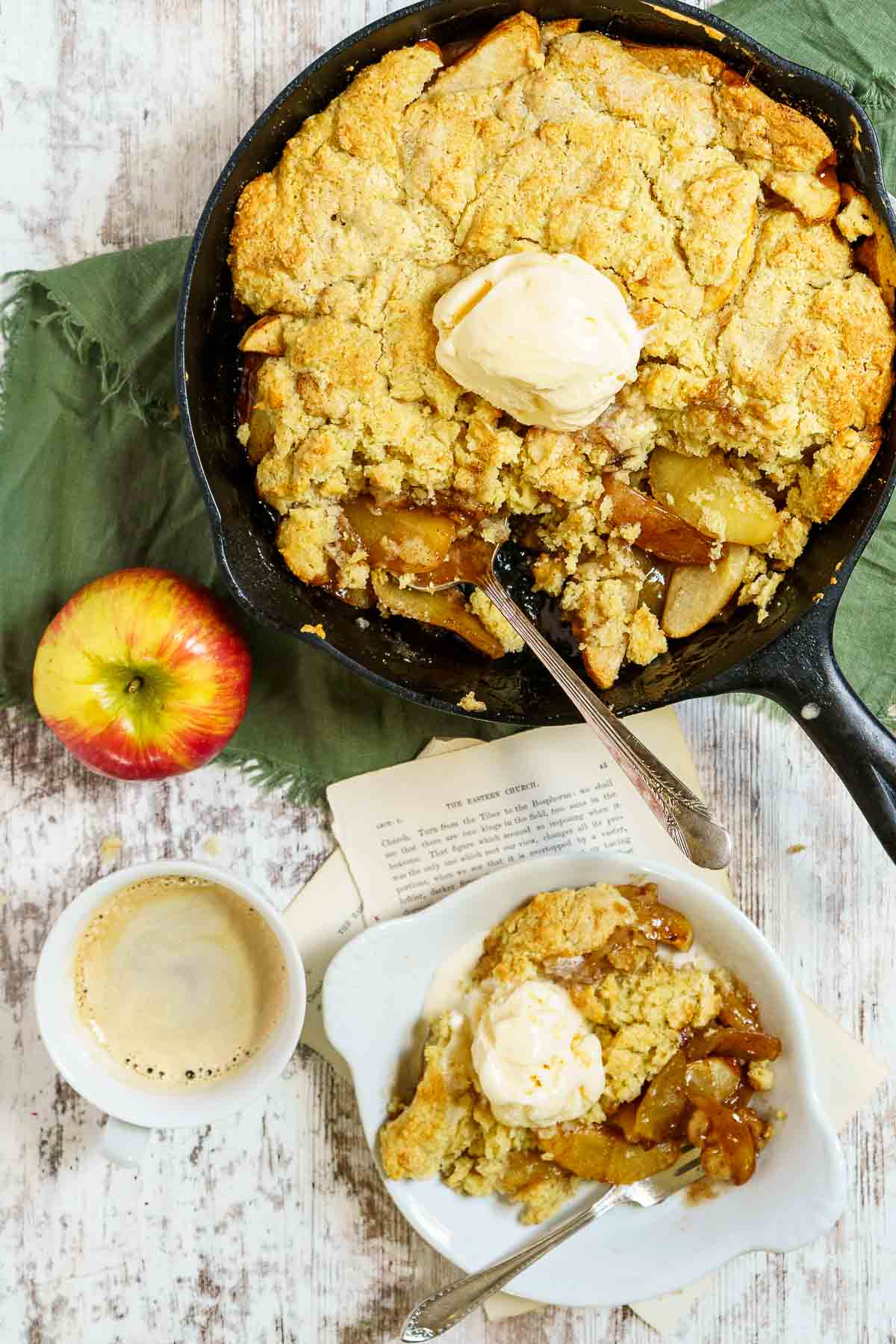 a serving gluten free apple cobbler with vanilla ice cream and a cup of copy