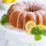 gluten free cake with lemon glaze on a cake stand