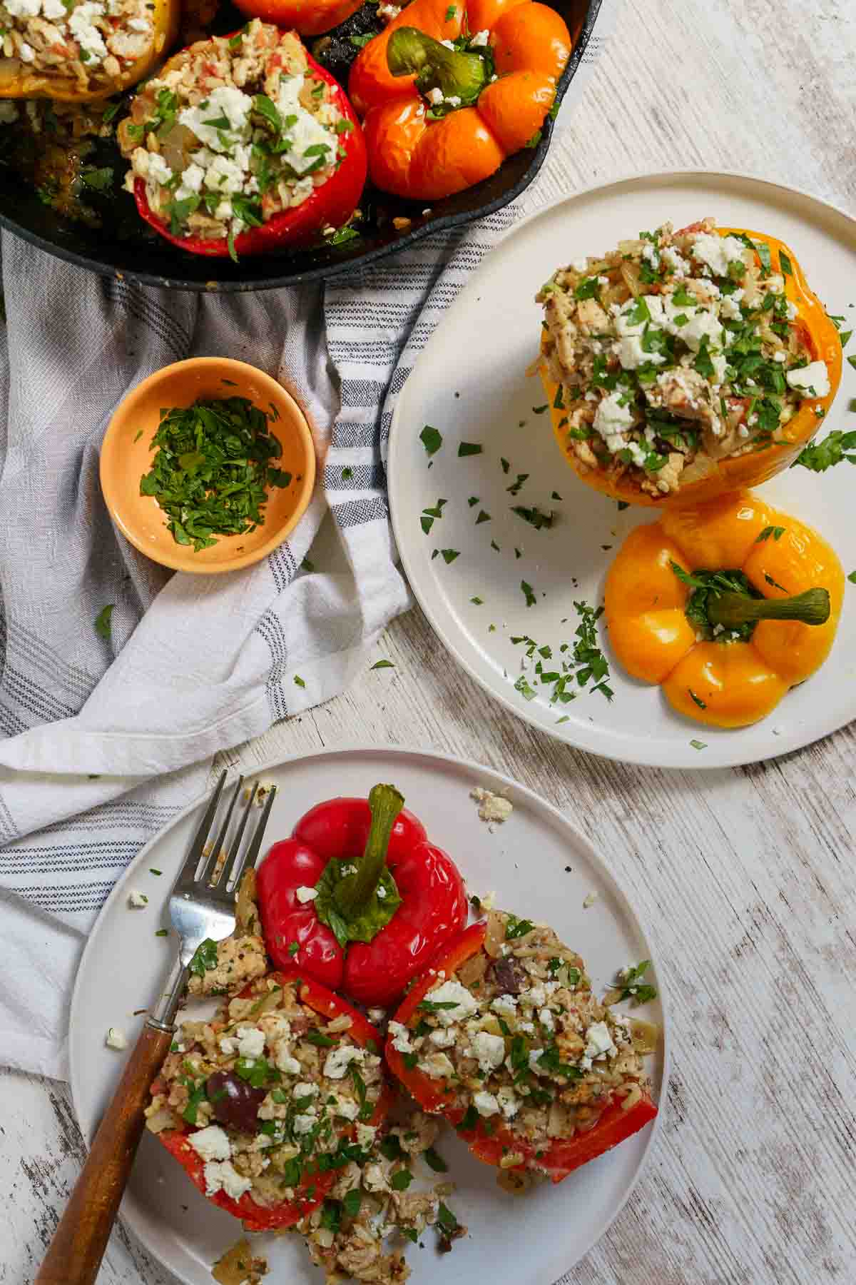 stuffed peppers being served on dinner plates