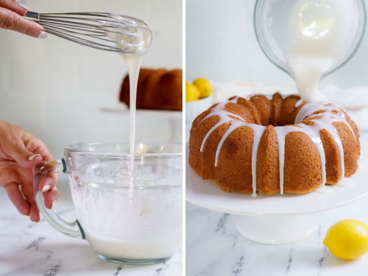 A person whisks white icing in a glass measuring cup, then pours it over a gluten-free lemon drizzle cake on a cake stand. Lemons are visible on the white countertop.