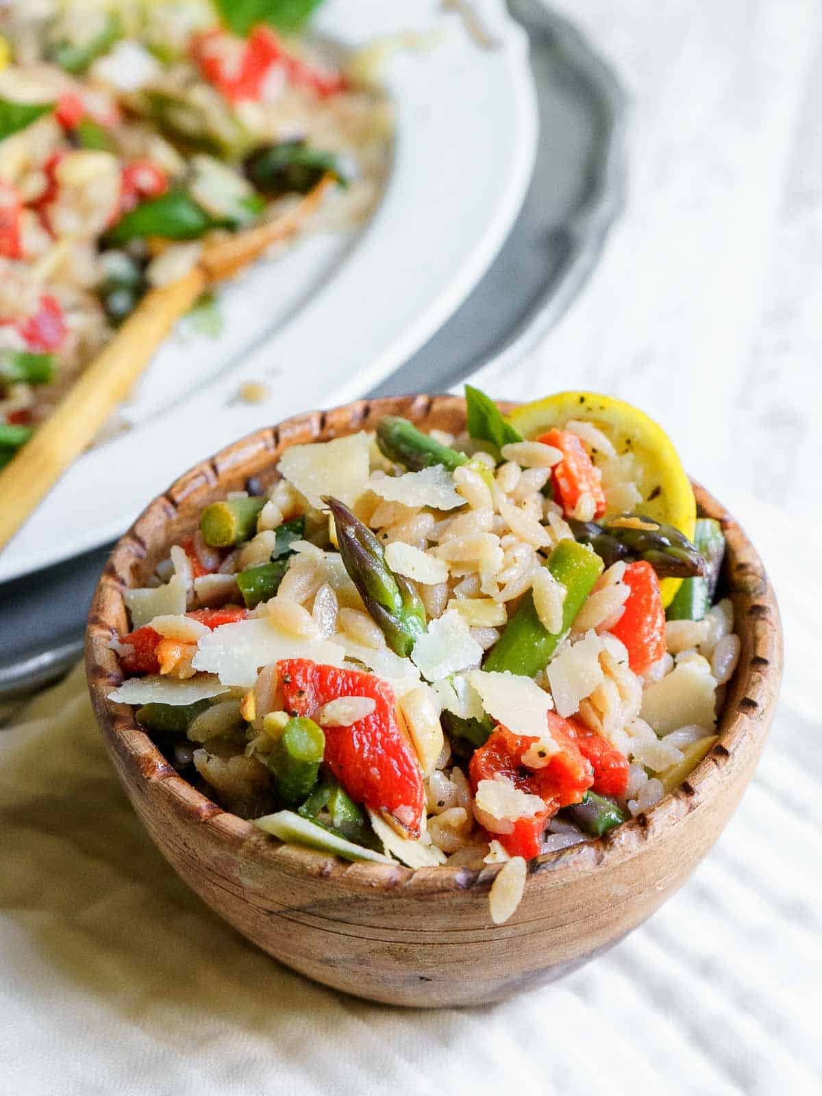 bowl of orzo salad with asparagus