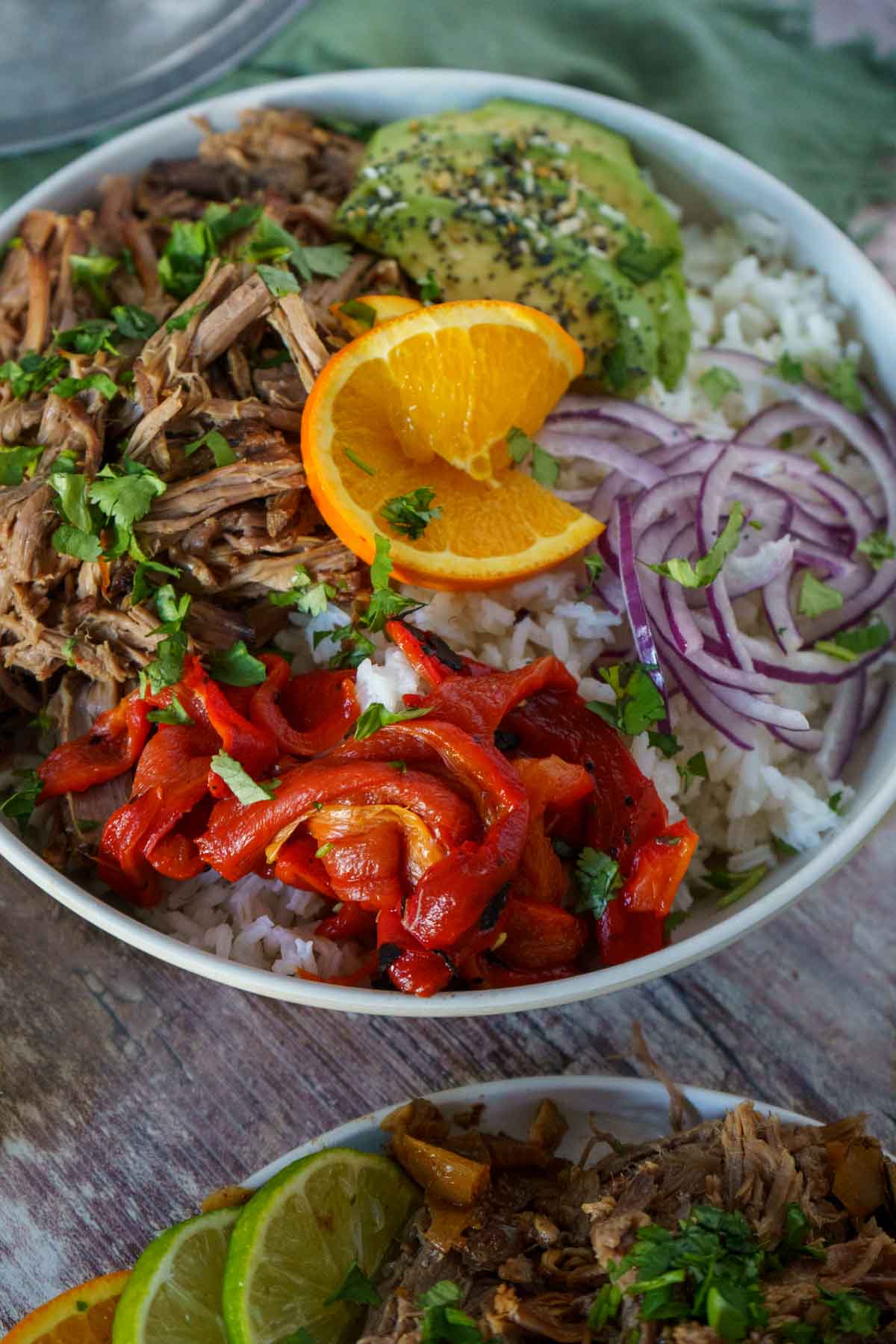 Shredded beef and veggies in a rice bowl.