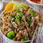 Shredded beef with garnished with cilantro on a plate.