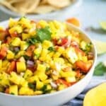 mango salsa in a white bowl.