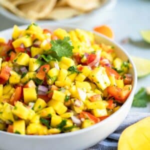 mango salsa in a white bowl.