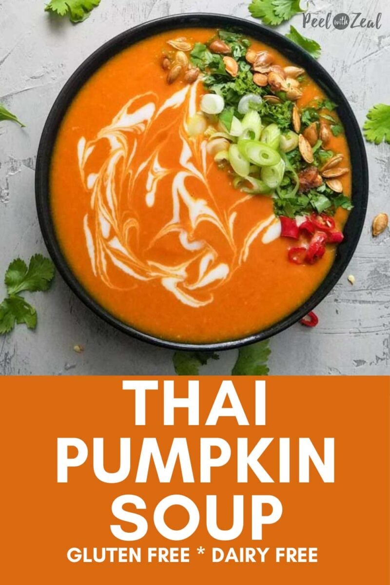 Bowl of pumpkin soup with garnishes.