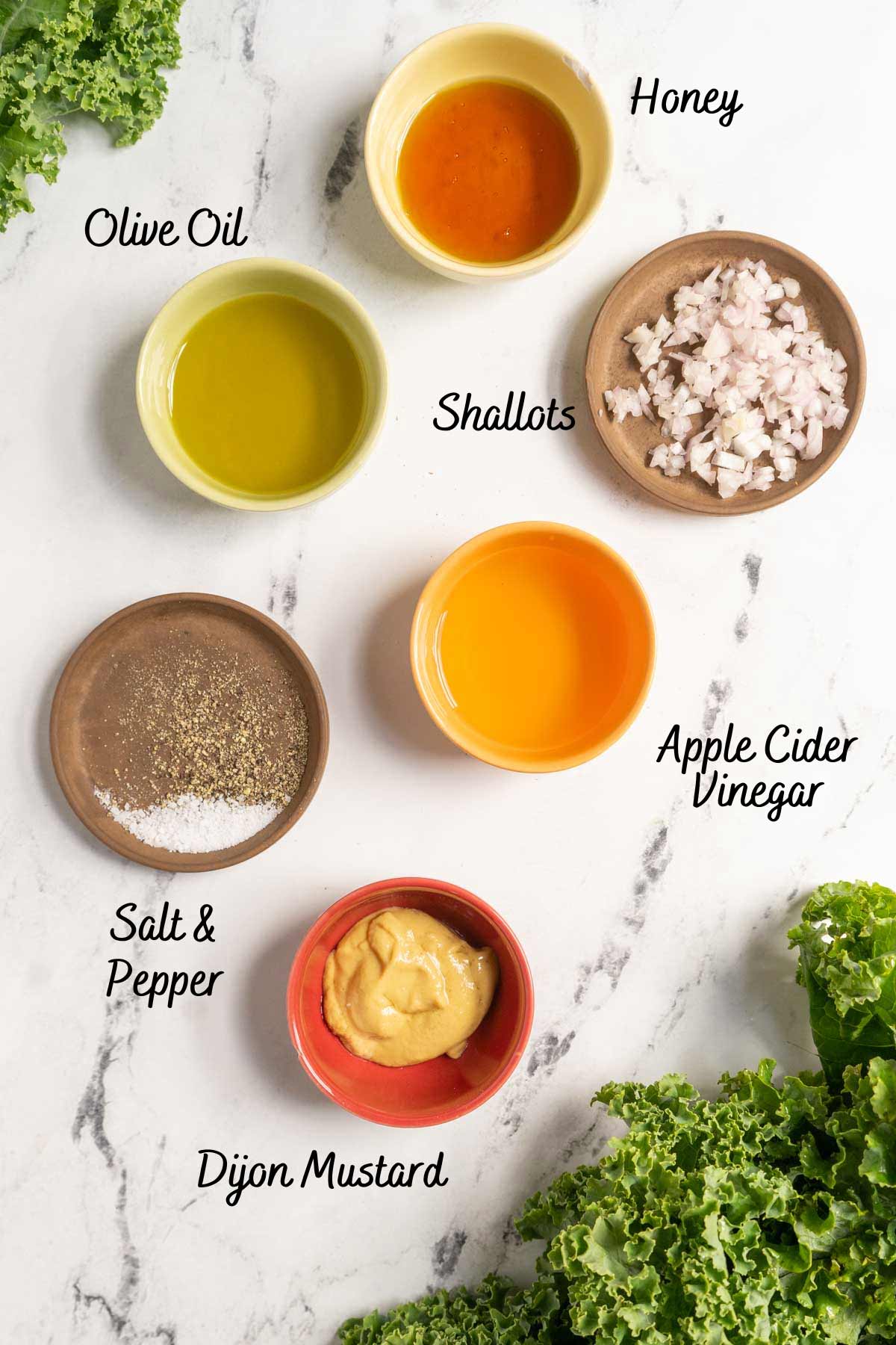 Salad dressing ingredients on a counter.