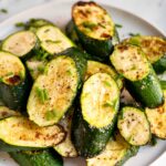 Roasted zucchini on a plate.