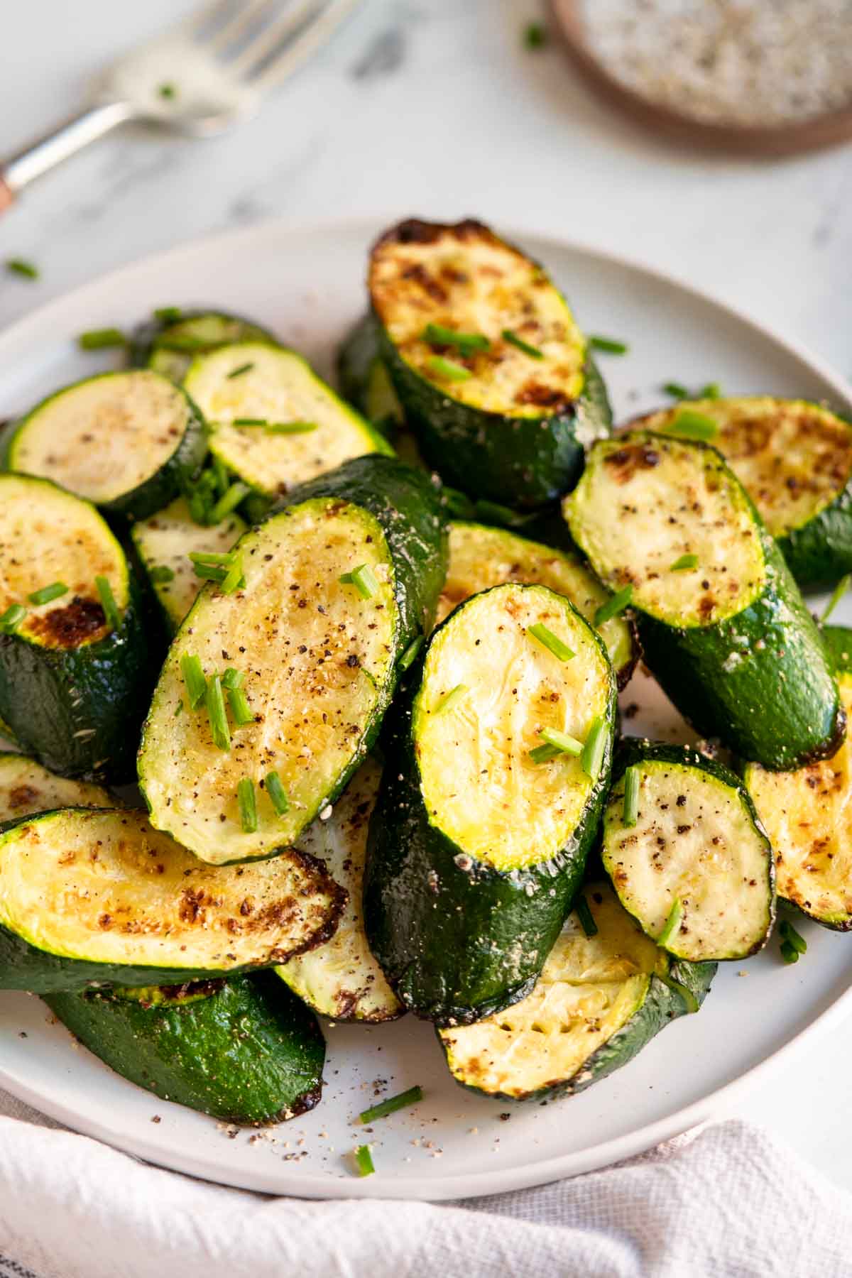 Roasted zucchini on a plate.