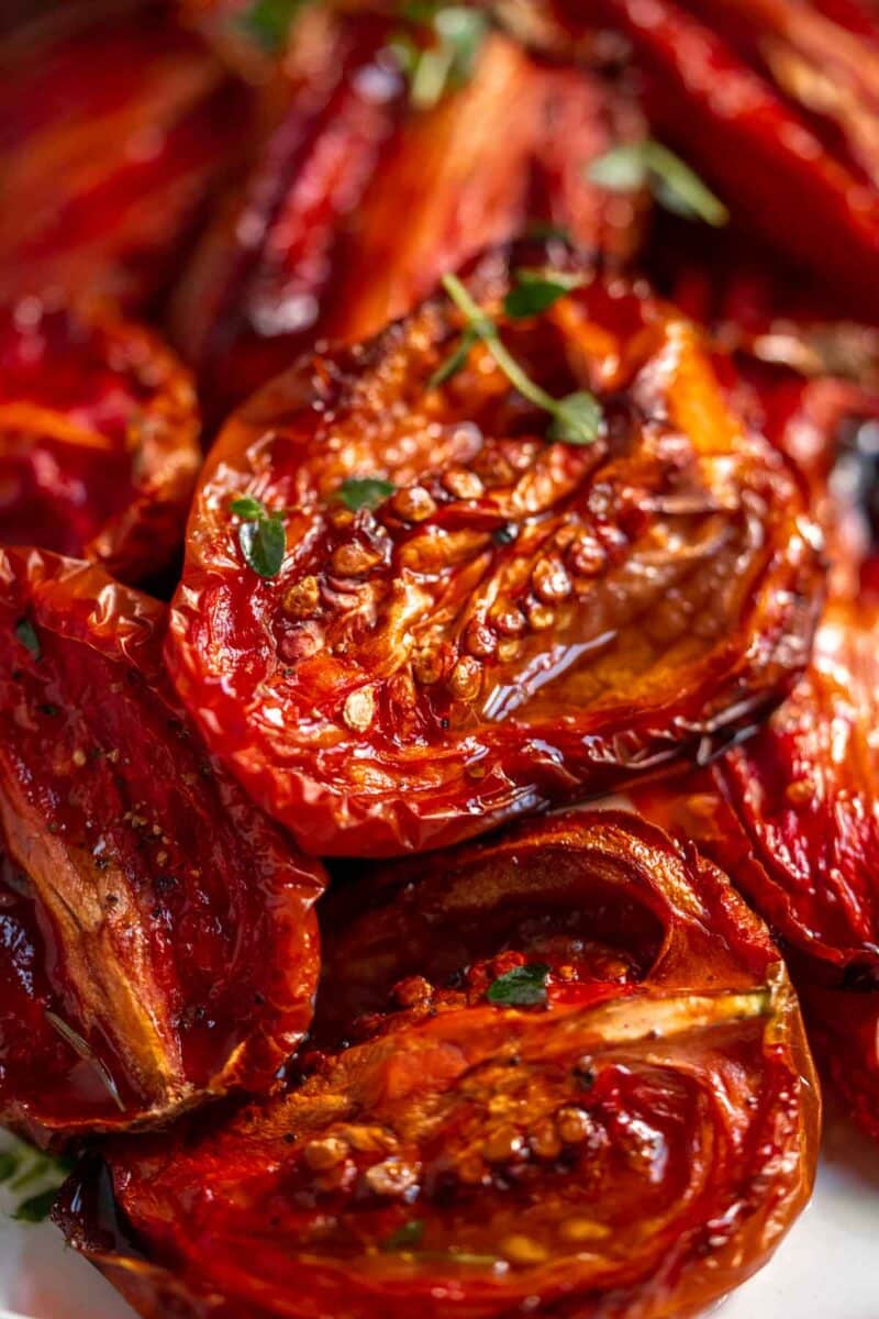 Roasted tomatoes sprinkled with fresh thyme.
