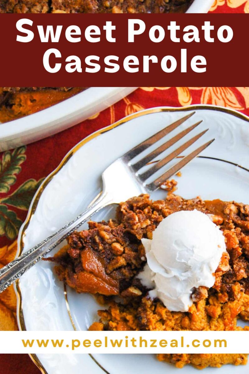 Sweet potato casserole on a plate with pecans and whipped cream.