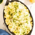 Cheese mashed potatoes in a serving dish.