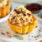 Ground turkey, quinoa, and cranberries stuffed in an acorn squash half.