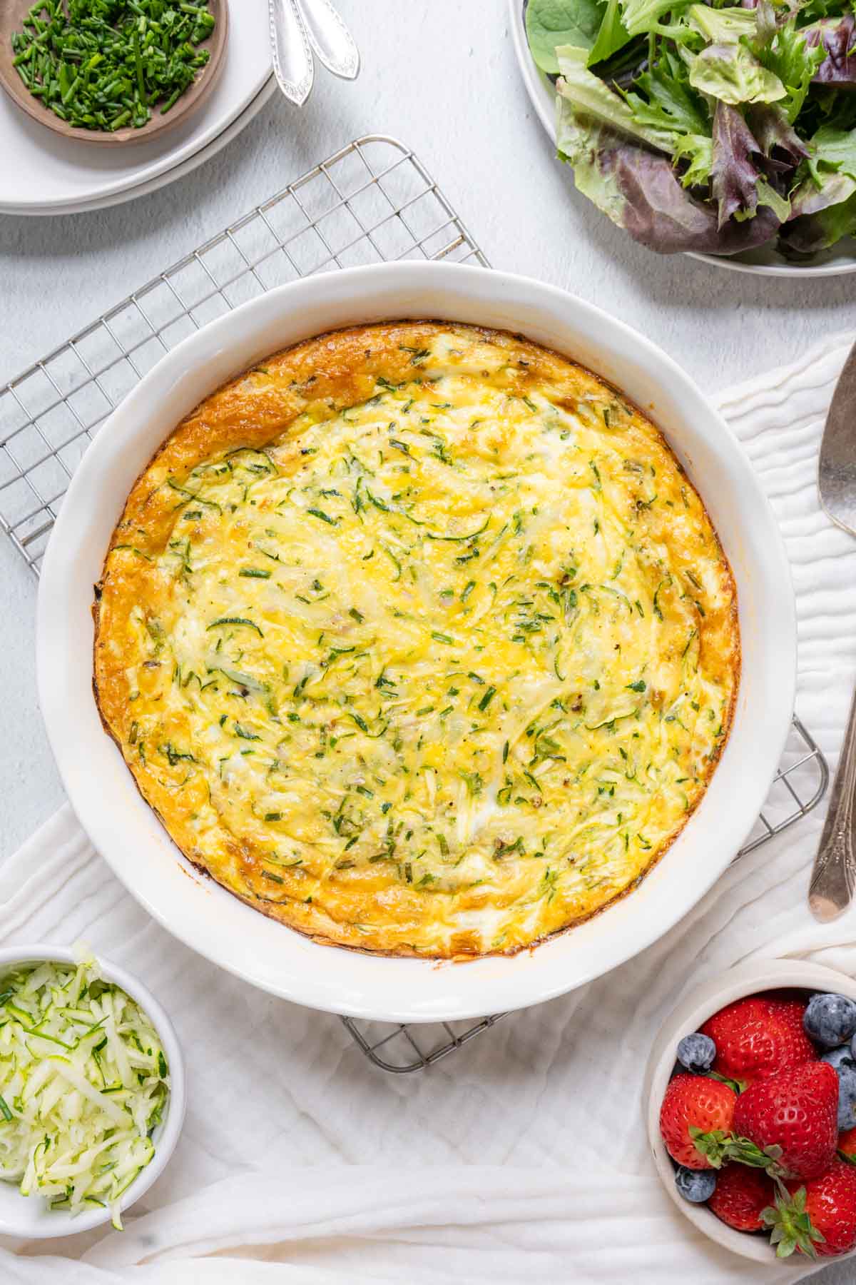 Crustless quiche cooling on a wire rack.