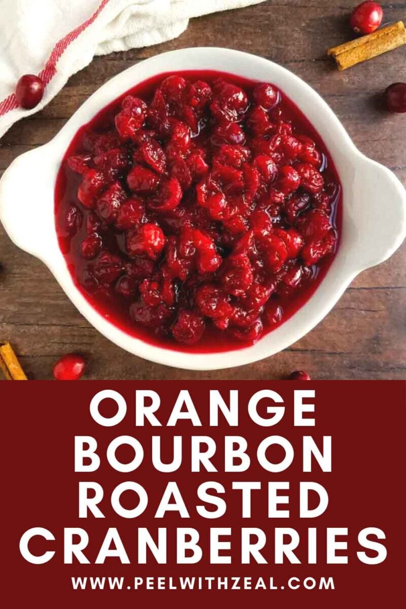 Cranberries in a serving dish with cinnamon sticks.