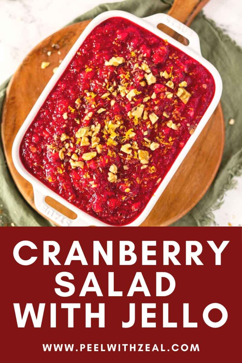 Cranberry salad with walnuts and orange zest in a serving dish.