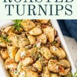 Roasted turnips with goat cheese in a white serving dish.